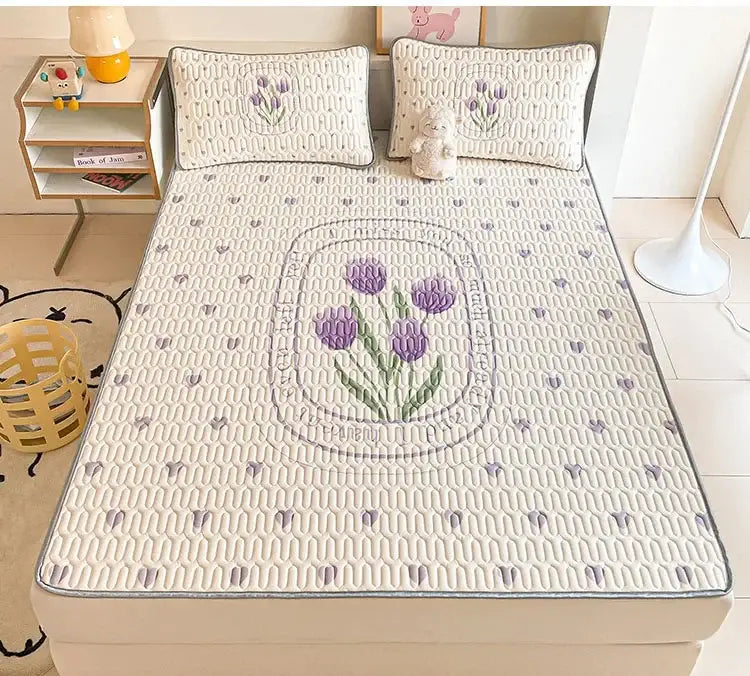 Cream-colored quilted bed pad with embroidered purple tulips and a gray border for decorbites cartoon pattern latex mattress