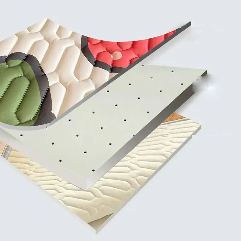Beige and red quilted foam panels with perforated metal backing showing the back side of a cartoon pattern latex mattress by decorbites