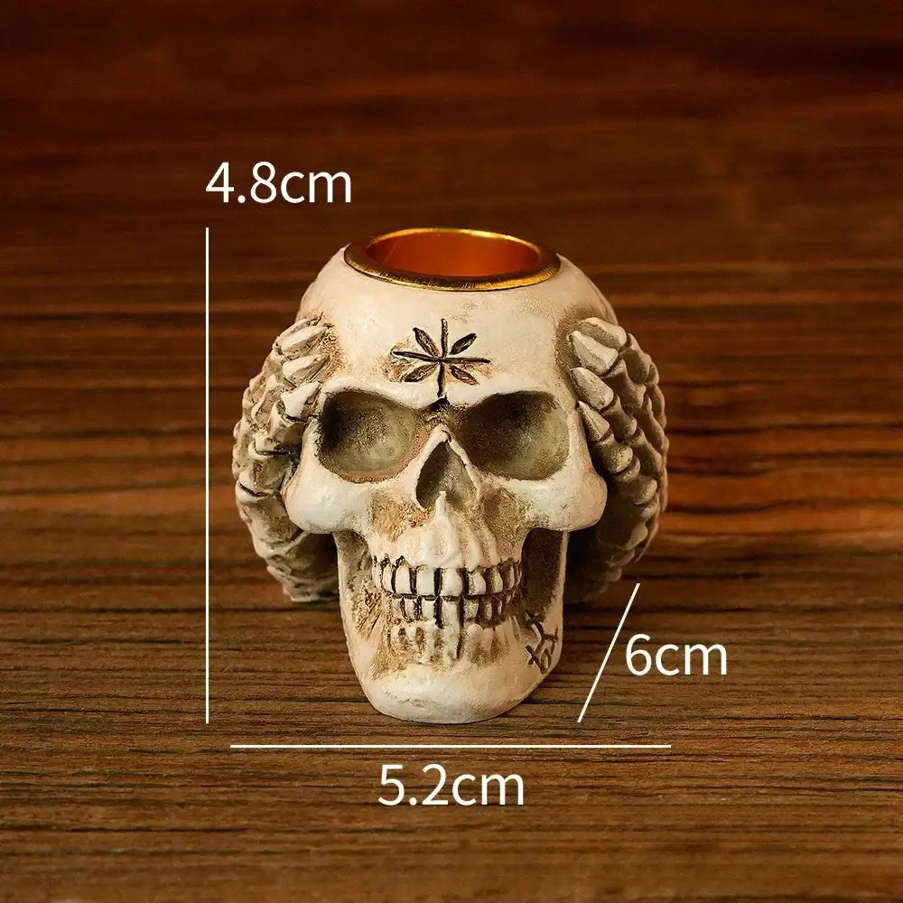 Beige resin bone skeleton candlestick holder with white detailed skull design gold rim decorbites bone skeleton decor