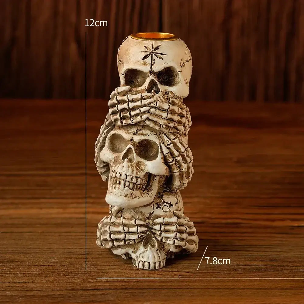 Beige resin bone skeleton candlestick holder with three skulls and skeletal hands for dining room decorbites bone skeleton decor