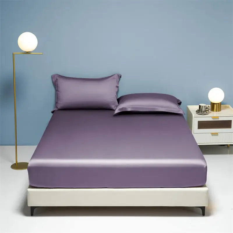 Purple satin bed sheet with matching pillowcases featuring smooth glossy finish in decorbites 1000tc egyptian cotton fitted sheet set