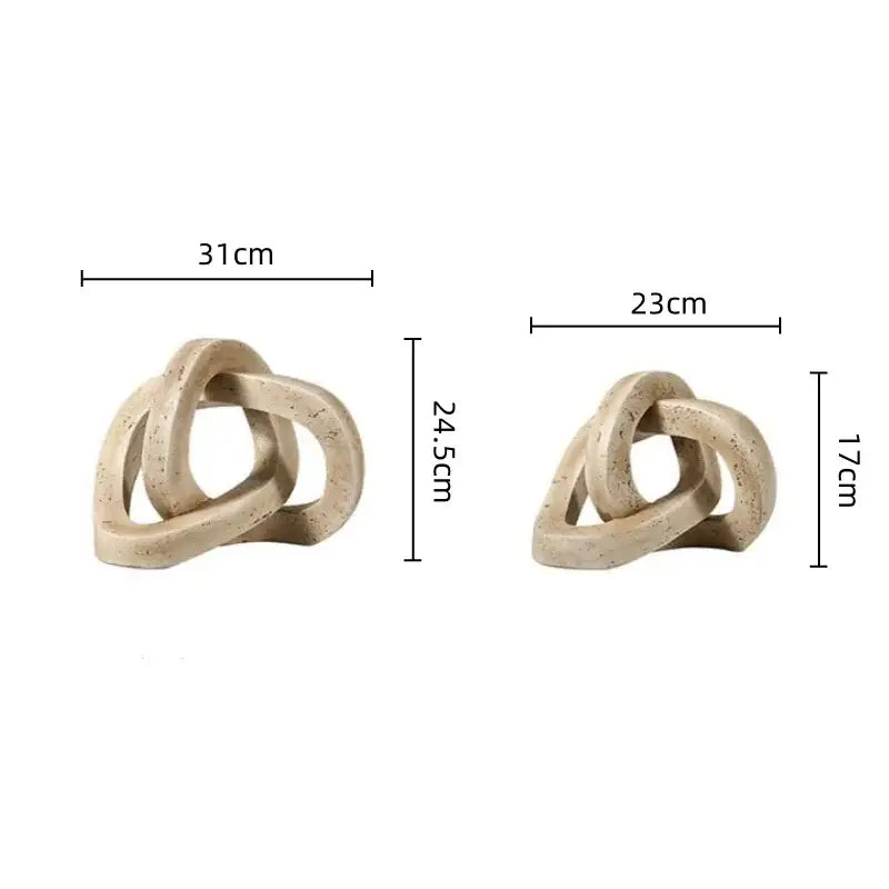 Beige ceramic living room sculpture with speckled finish and geometric interlocking loop knot design