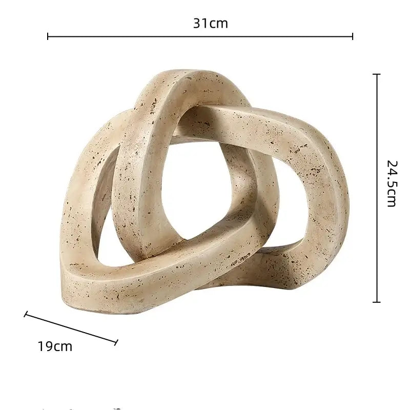 Beige speckled stone sculpture featuring a geometric interlocking loop knot design for living room decor