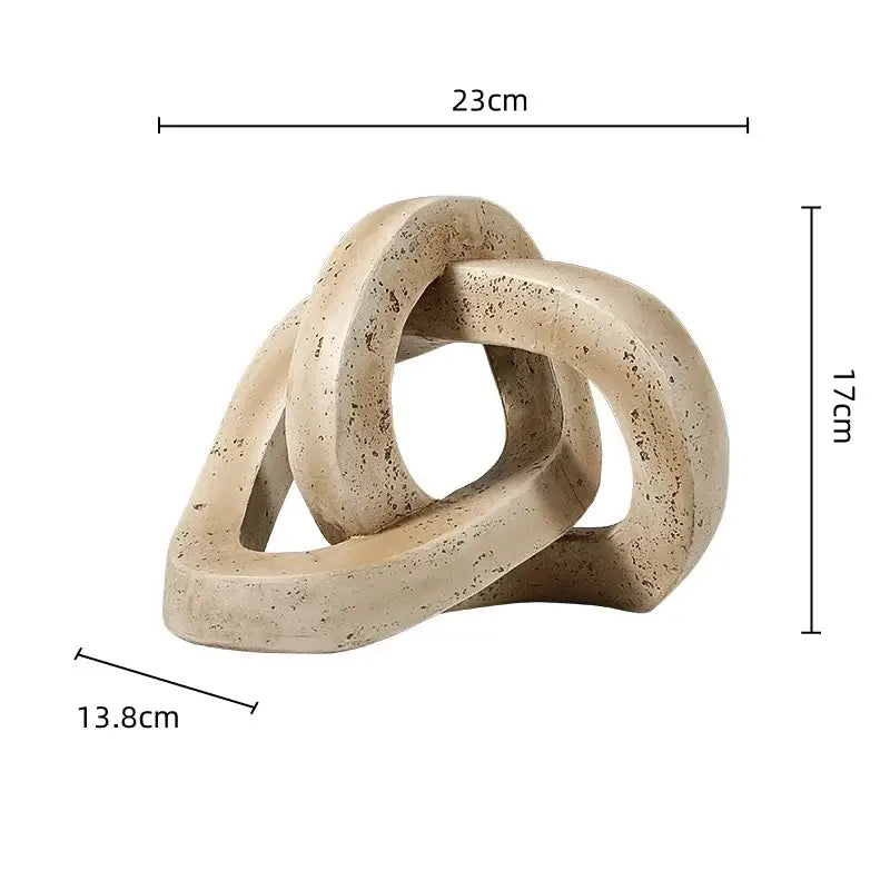 Beige speckled stone living room sculpture with geometric interlocking loop knot design