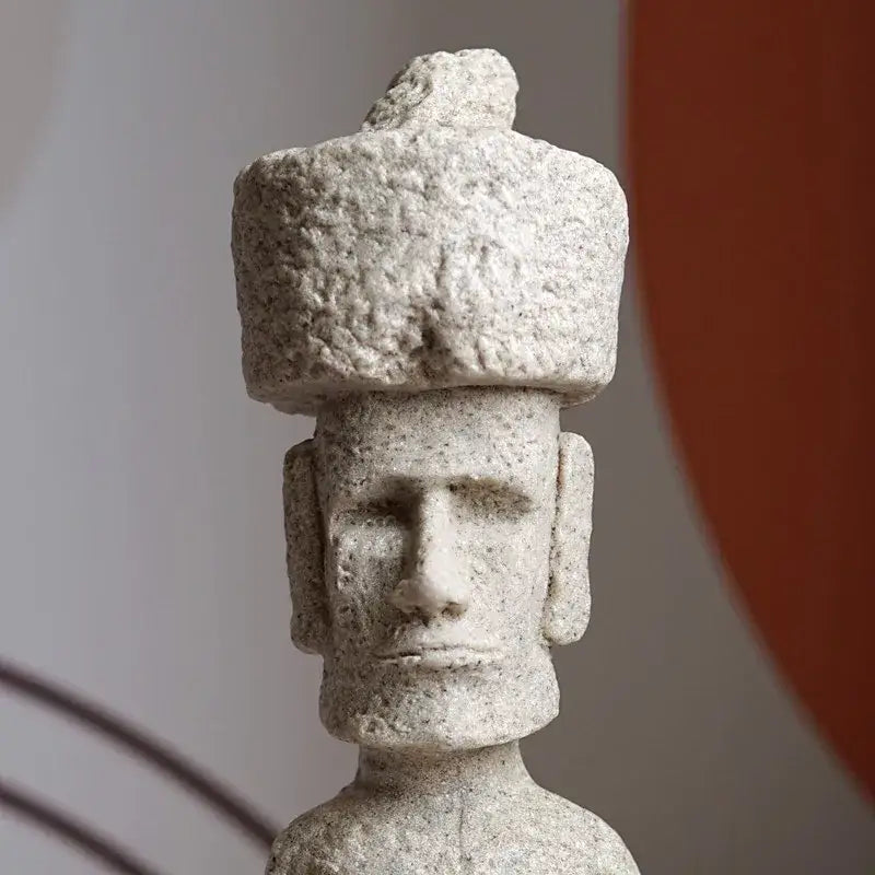 Beige stone easter island moai pukao statue with textured rounded hat and carved facial features for living room decor