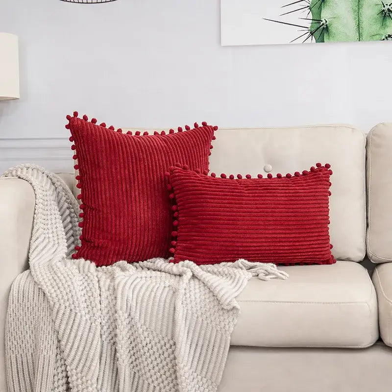 Red corduroy throw pillows with pom pom trim complement decorbites beige striped cushion cover for living room decor
