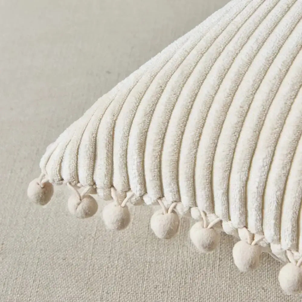 Beige striped corduroy cushion cover with cream-colored fabric and soft pom pom trim for living room decorbites decor