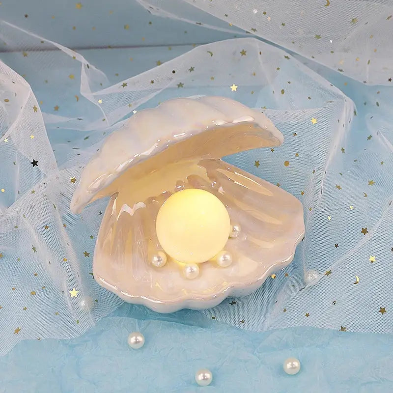 Beige and terracotta decorbites ceramic shell pearl night light with glowing yellow orb and small pearls for bedroom decor