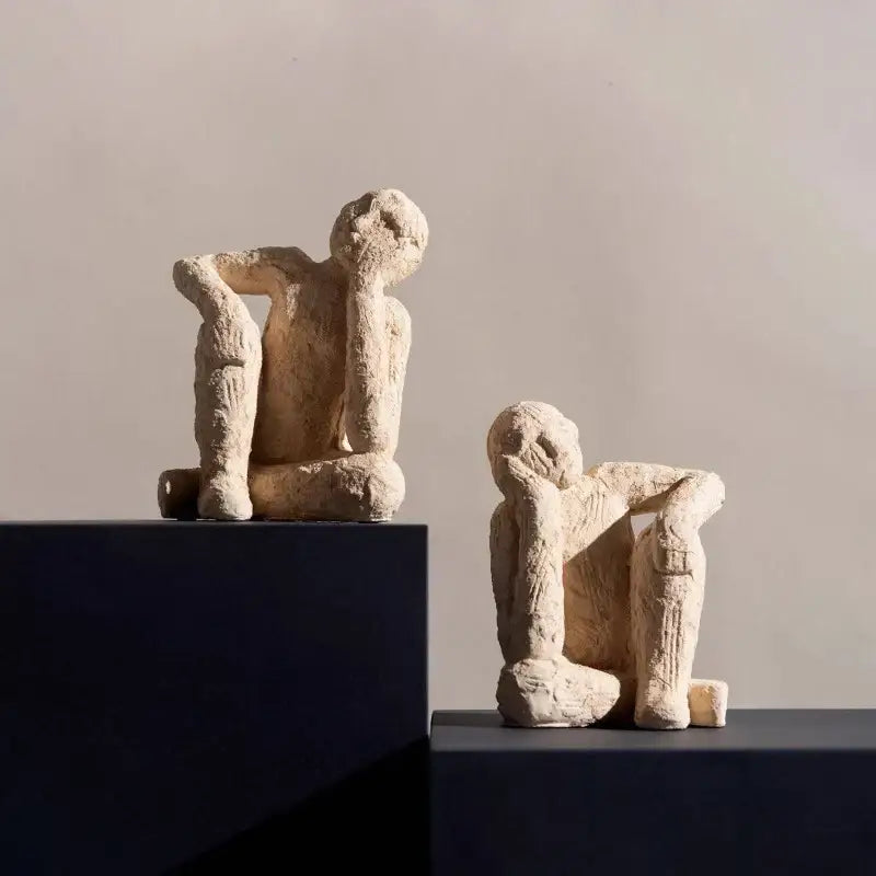 Two beige textured abstract resin figurine sculptures depicting human forms for living room decorbites decor