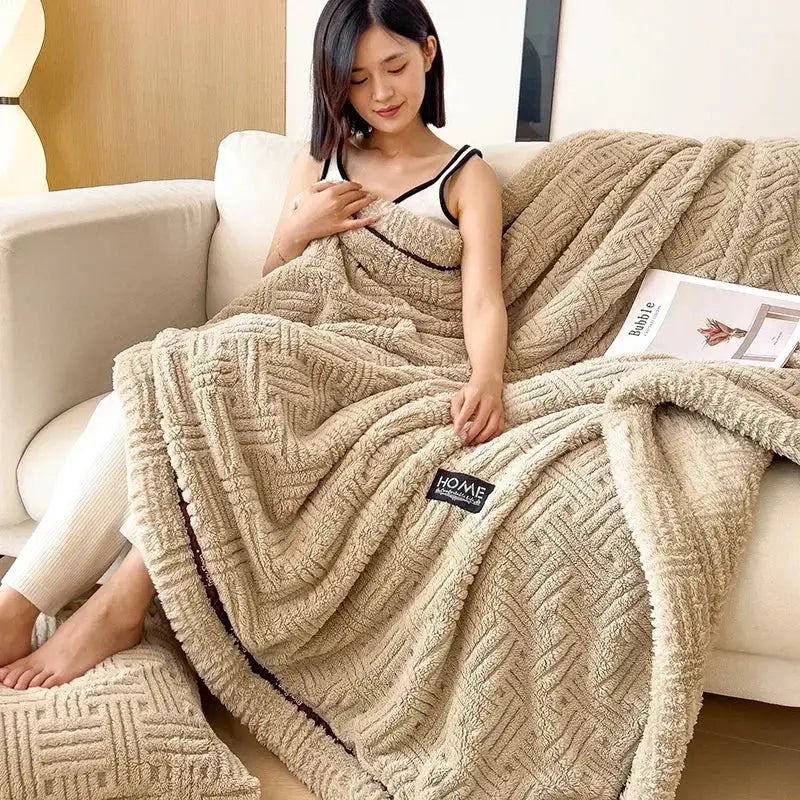 Beige textured cozy fluffy fleece blanket with woven herringbone pattern and black trim for bedroom decorbites cozy fluffy use