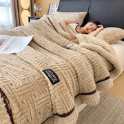 Beige textured cozy fluffy fleece blanket with woven pattern and brown trim decorbites cozy fluffy bedroom throw