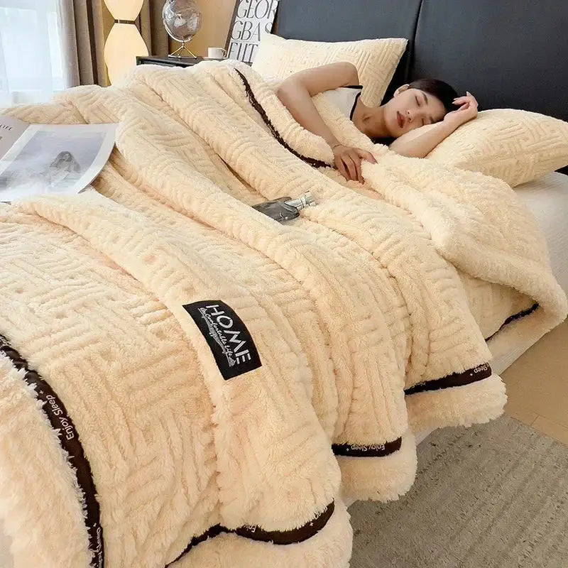 Beige textured cozy fluffy fleece blanket with dark brown trim and homme brand label for decorbites cozy fluffy use