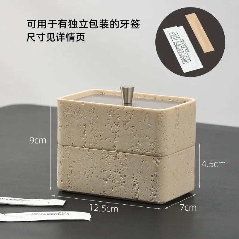 Beige textured natural stone toothpick holder with metallic silver lid complementing double decker jewelry organizer