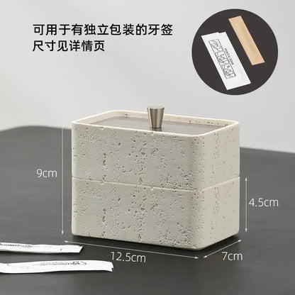 Beige textured natural stone double decker jewelry organizer with a modern off-white ceramic toothpick holder and metallic lid