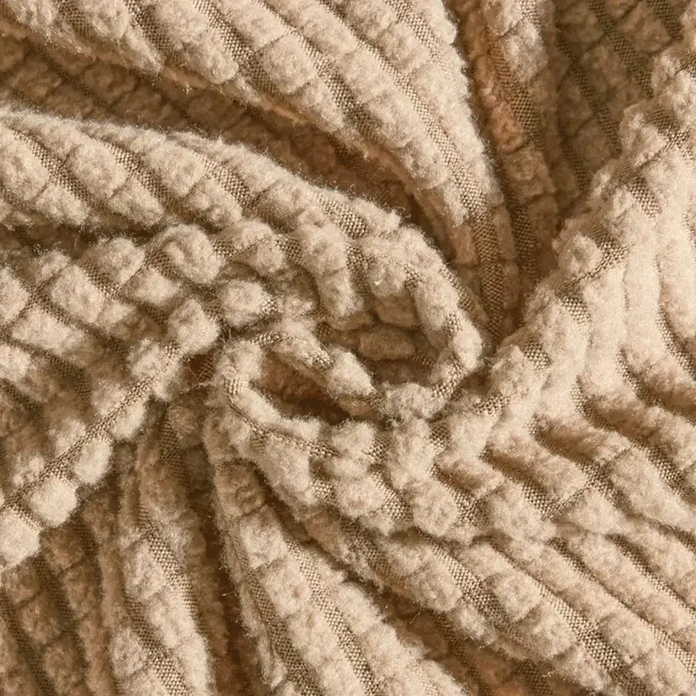 Beige textured quilted sofa cover with pillows in beige corduroy fabric featuring a ribbed pattern for living room decorbites 3d quilted