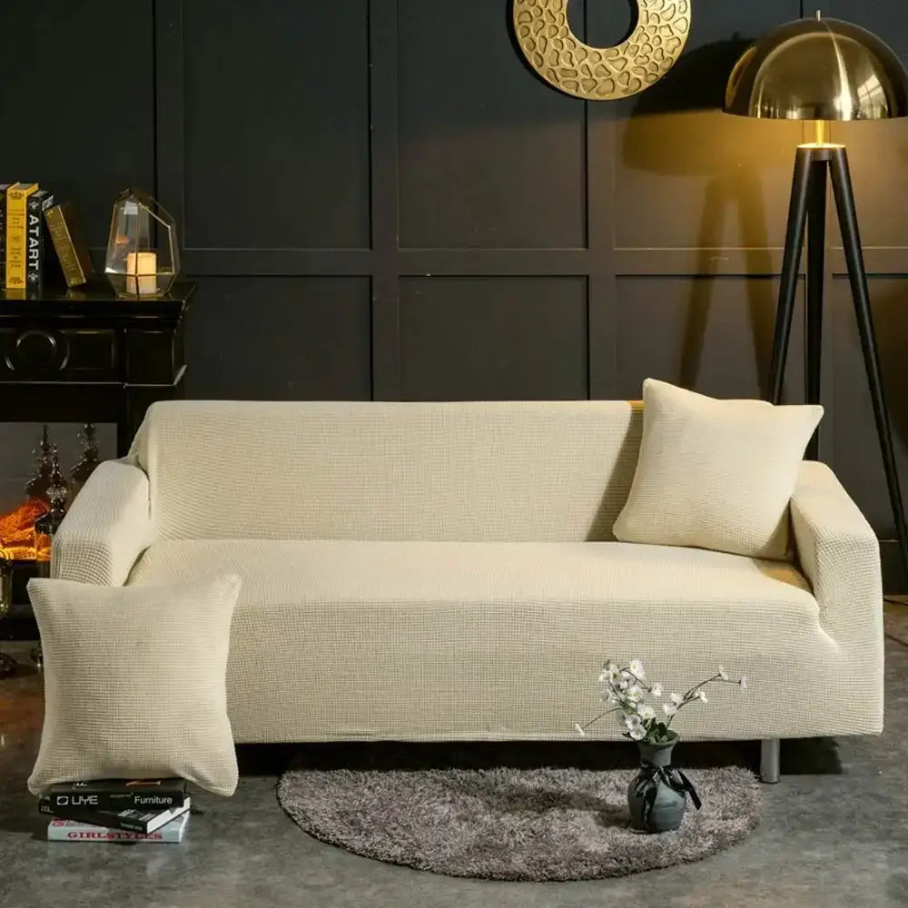 Beige textured quilted sofa cover with decorbites 3d quilted design and matching throw pillows for living room decor