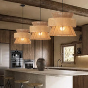 Beige tiered handmade hemp rope pendant light with woven rattan perforated shades hanging from black cords decorbites handmade hemp