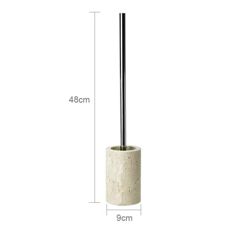A sleek 48cm tall toilet brush with polished chrome handle and textured beige travertine marble base for bathroom decor