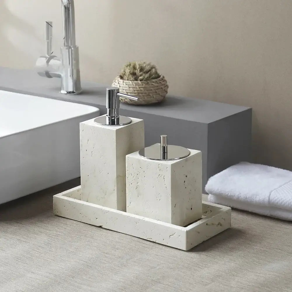 Beige travertine marble bathroom set with cream-colored stone and chrome pump dispensers by decorbites travertine marble