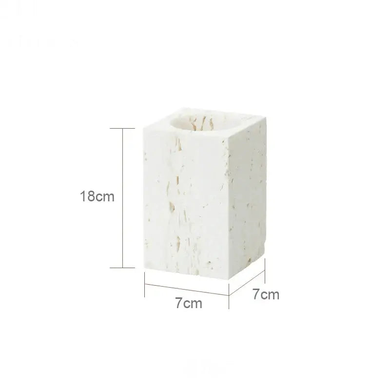 A white textured stone candle holder in beige travertine marble with square shape and 18cm height from decorbites beige travertine set