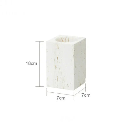 A white textured stone candle holder in beige travertine marble with square shape and 18cm height from decorbites beige travertine set
