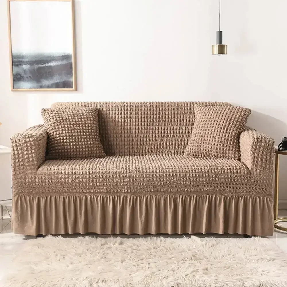 Beige waffle textured cozy sofa cover with ruffled hem solid color slipcover for living room use