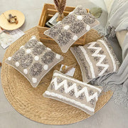 Set of four beige and white cushion covers with diamond tufted zigzag chunky knit patterns for living room decor