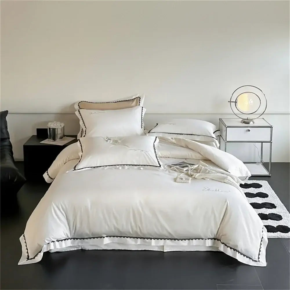 Elegant white satin bedding set with black scalloped trim and embroidery from decorbites hot diamond lace collection