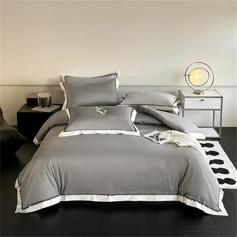 Gray bedding set with white trim and subtle embroidery from decorbites hot diamond lace duvet cover collection