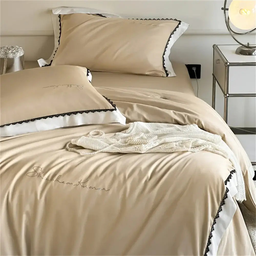 Beige satin bedding set with black lace trim and embroidered script detailing from decorbites hot diamond lace collection
