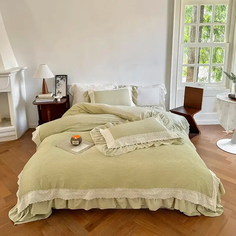 Soft sage green duvet cover bedding set with delicate cream lace ruffles and textured ruffled edges for bedroom use