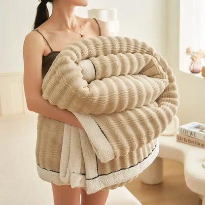 Beige ribbed fleece plush blanket with soft texture and white trim from decorbites cozy rabbit plush collection