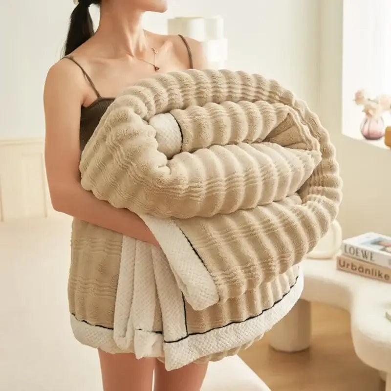 Beige ribbed fleece plush blanket with soft texture and white trim from decorbites cozy rabbit plush collection