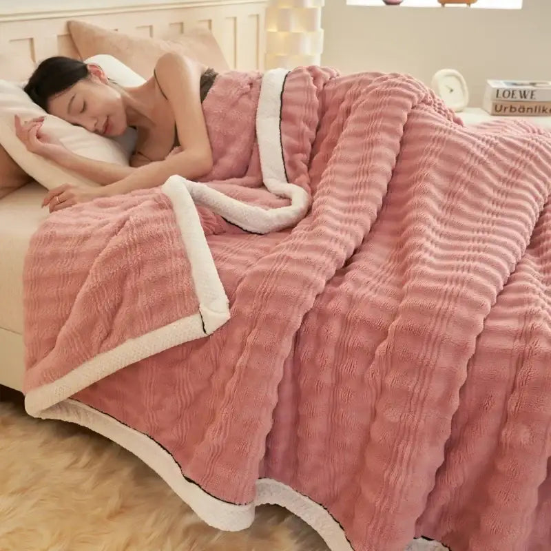 Pink plush blanket with white fleece border and ribbed texture complementing beige white striped rabbit plush decorbites cozy rabbit throw
