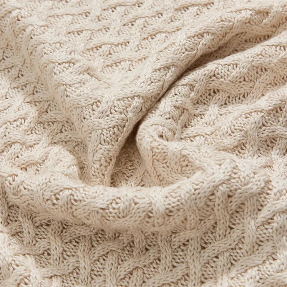 Cream-colored cable-knit bamboo sweater with textured pattern ideal for decorbites cool summer air conditioning use