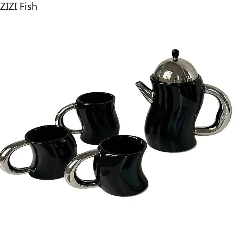 Black ceramic teapot with silver lid and handle and three matching bending design ceramic coffee mugs with chrome handles