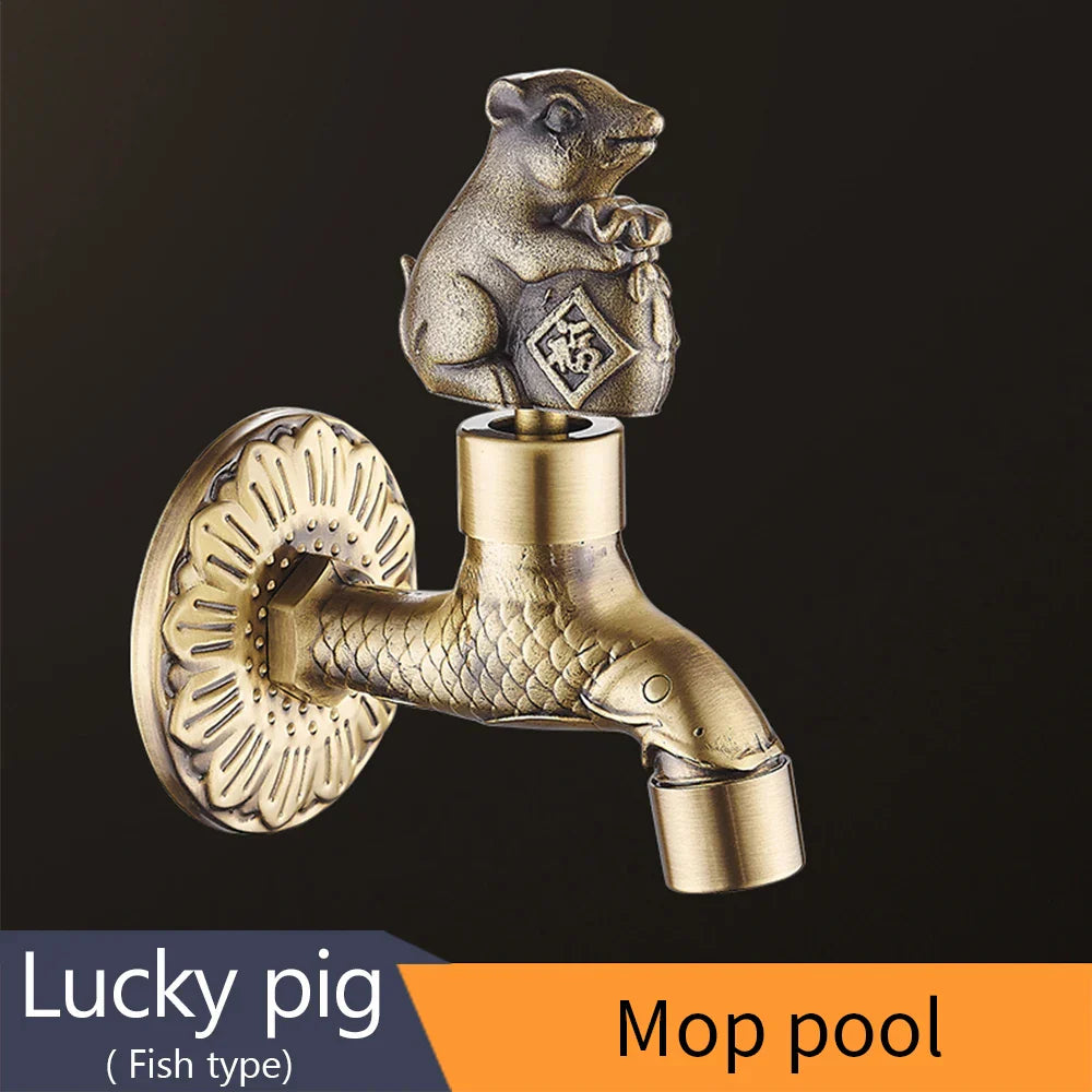 Brass-colored antique bronze bidcock washing machine faucet with fish-shaped spout and ornate lucky pig handle design