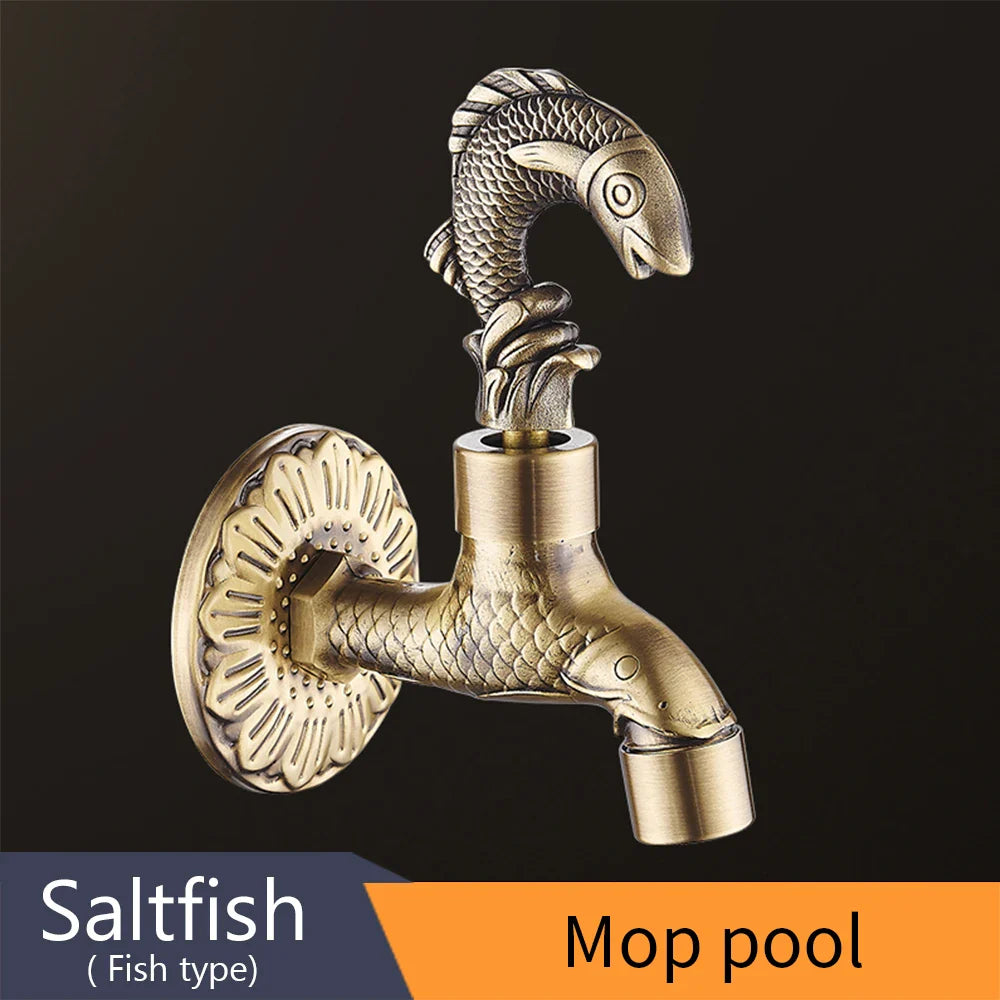 Antique brass-colored bidcock washing machine faucet featuring fish design with detailed scales and ornate mounting plate