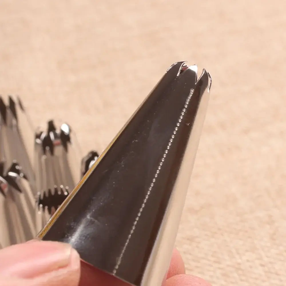 Shiny metallic big size russian pastry nozzle with blackened interior and serrated edges for cake decorating decorbites big size