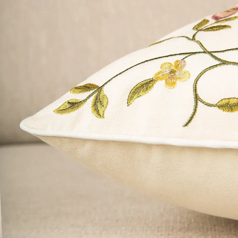 Cream-colored bird embroidered cotton cushion cover with delicate gold and green floral embroidery for living room decorbites decor