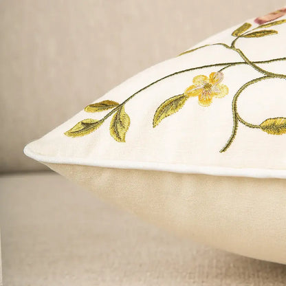 Cream-colored bird embroidered cotton cushion cover with delicate gold and green floral embroidery for living room decorbites decor