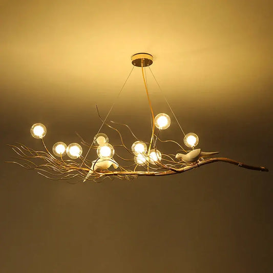 Warm-toned metal bird nest led pendant light resembling a branch with birds featuring spherical bulbs for dining room decor