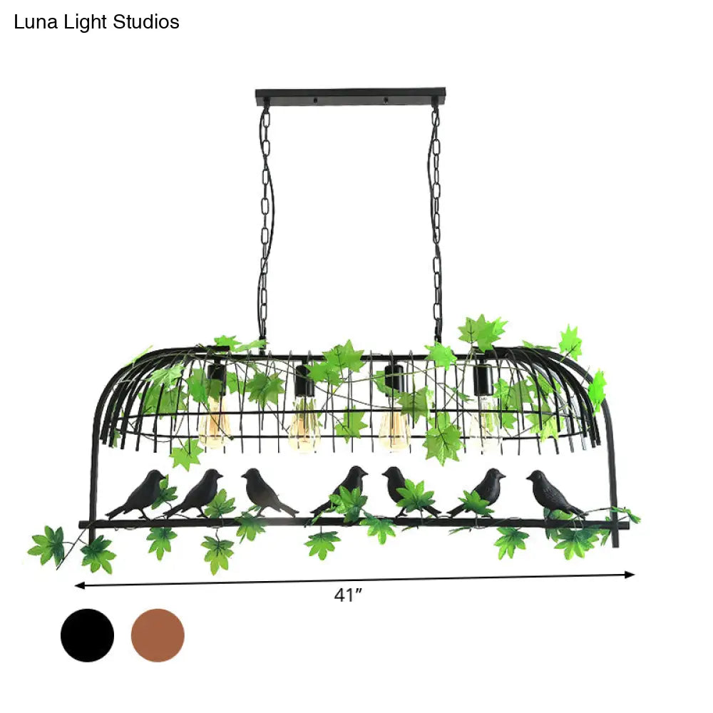 مصباح جزيرة غرفة الطعام المصنوع من الحديد الصناعي على شكل قفص طيور من DecorBites™ - أسود/برونزي معلق مع نبات زخرفي وطائر