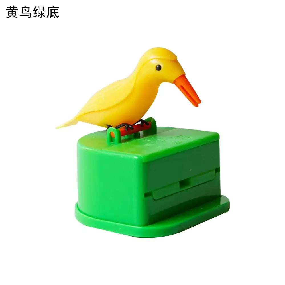 Yellow plastic birdie toothpick holder with orange beak on green base for kitchen storage and decorbites toothpick use