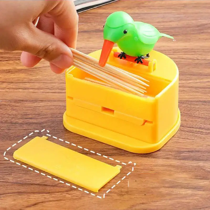 Yellow plastic toothpick holder with green decorbites birdie figurine on top for kitchen storage dispenser
