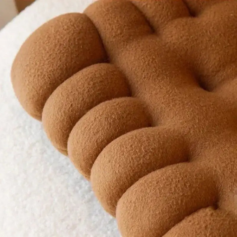 A plush tan decorbites biscuit sofa cushion with tufted segmented design for living room decor