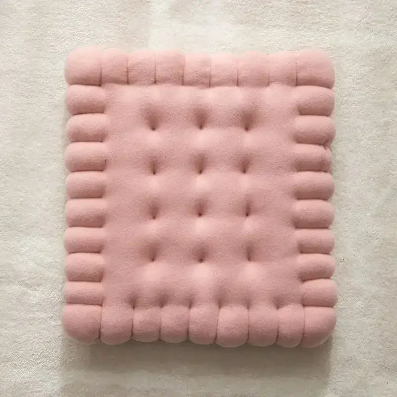 A soft pink plush rectangular decorbites biscuit sofa cushion with tufted texture and rounded edges for living room decor