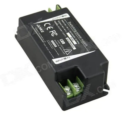 Black 15w led power supply adapter with green terminal connectors and white labeling for kitchen use