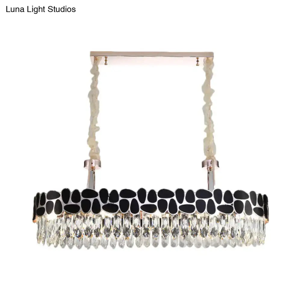 DecorBites black 8-head island lamp with modern clear crystal prisms and black stone accents in a sleek silver frame