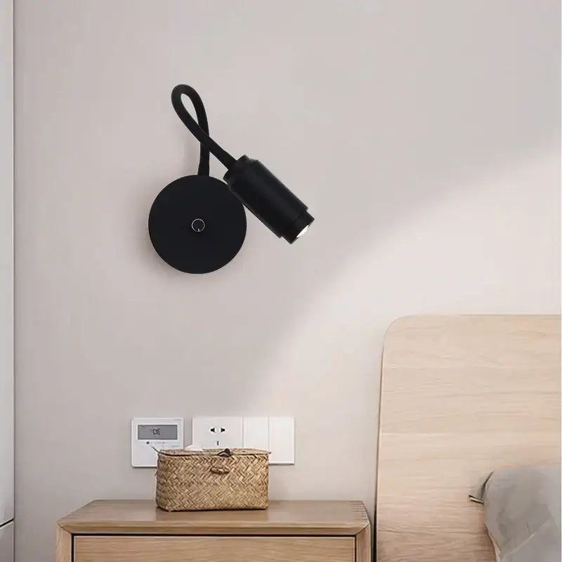 Black adjustable angle wall lamp with sleek curved arm and focusable led spotlight for bedroom decorbites adjustable angle